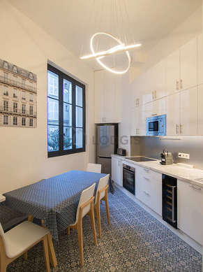 Kitchen where you can have dinner for 6 person(s) equipped with washing machine, refrigerator, extractor hood, crockery