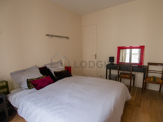 Bedroom with wooden floor