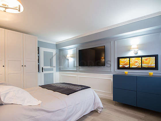 Bright bedroom equipped with tv
