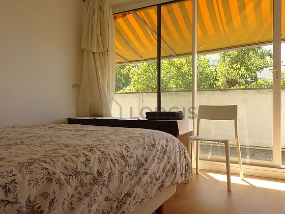 Bedroom with wooden floor
