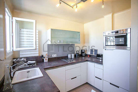 Kitchen where you can have dinner for 2 person(s) equipped with dishwasher, refrigerator, freezer, crockery