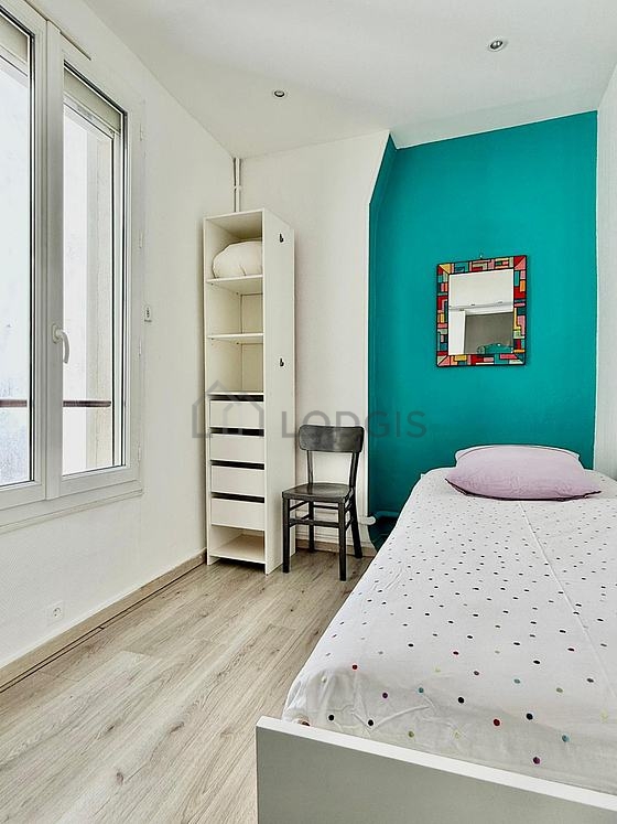 Bedroom with wooden floor