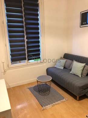 Very quiet living room furnished with sofa, coffee table