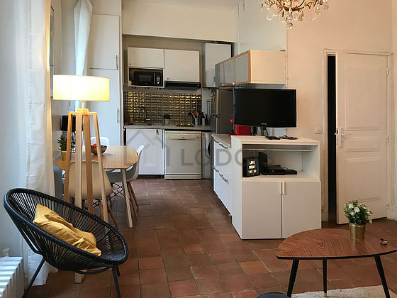 Quiet living room furnished with tv, 1 armchair(s)