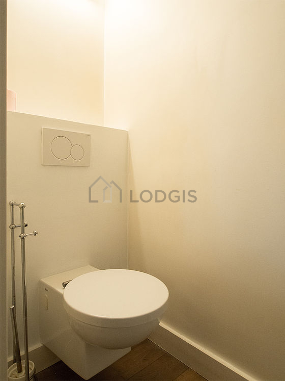 Pleasant bathroom with wooden floor