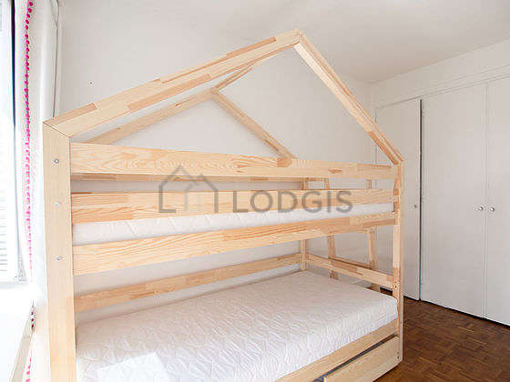 Very bright bedroom equipped with wardrobe