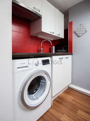 Kitchen equipped with washing machine, refrigerator