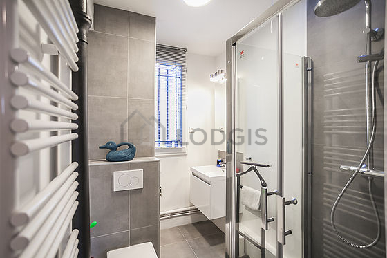 Beautiful bathroom with double-glazed windows and with tile floor