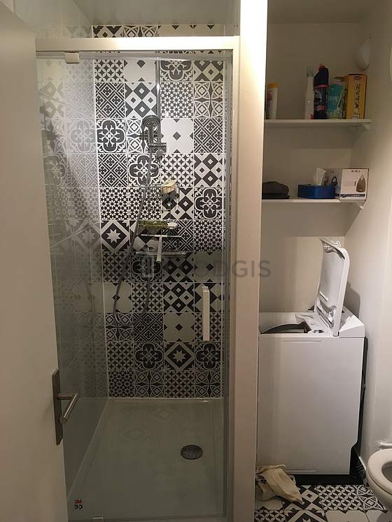 Bathroom equipped with washing machine, bath towels