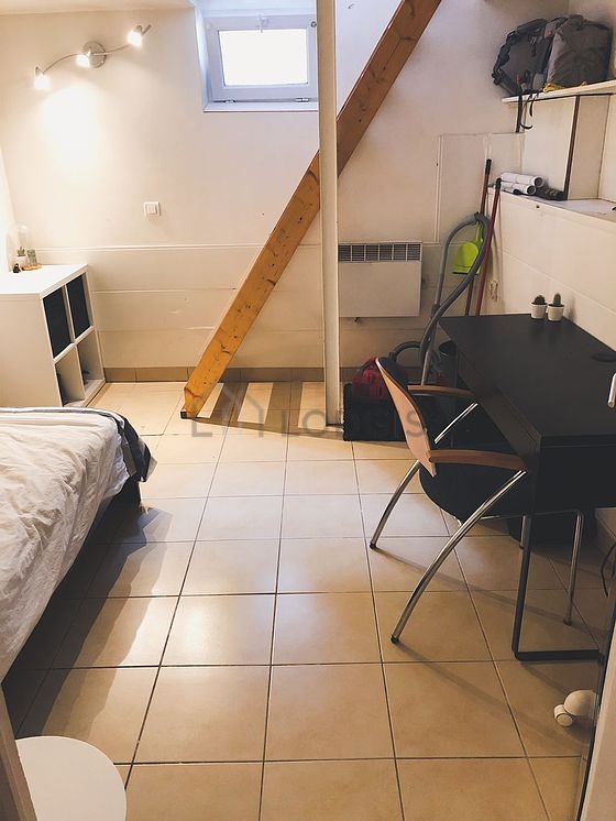 Bedroom with tile floor