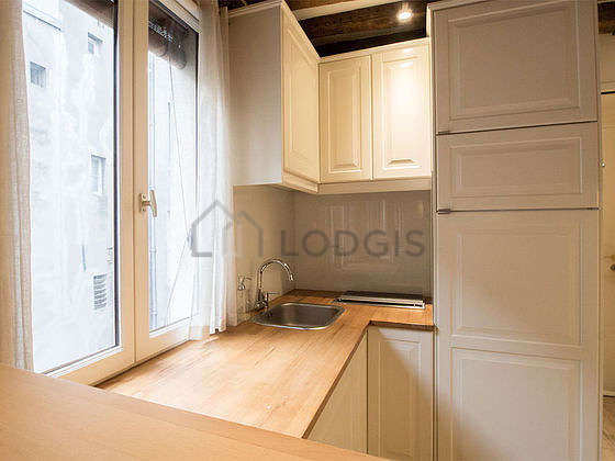 Kitchen where you can have dinner for 2 person(s) equipped with washing machine, refrigerator, crockery, stool
