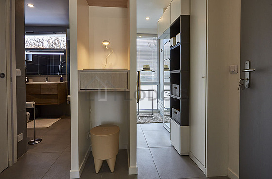 Bathroom equipped with washing machine, dryer, hair-dryer