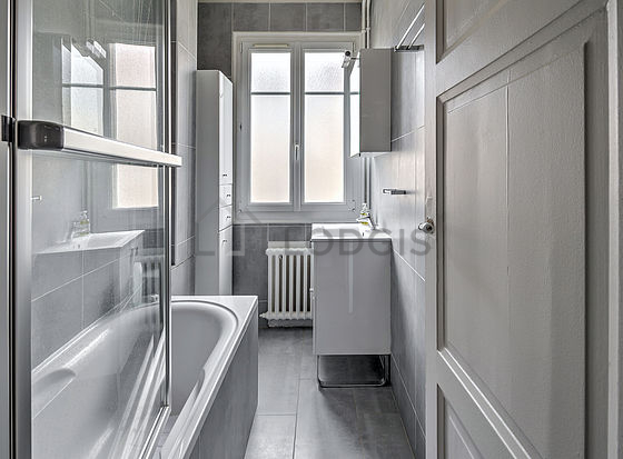 Pleasant and bright bathroom with tile floor