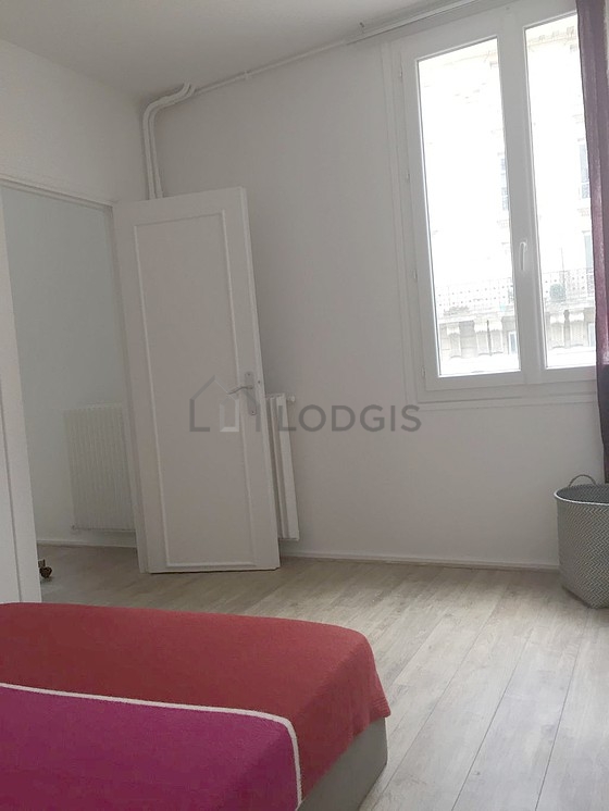 Bedroom with wooden floor