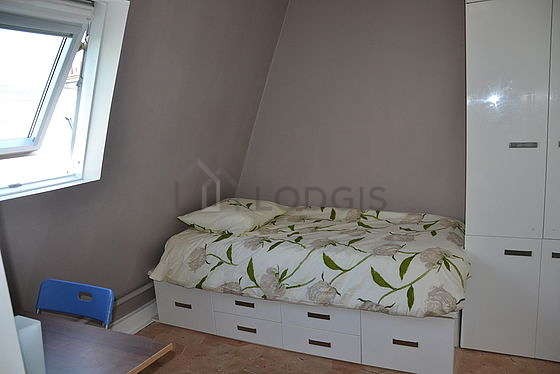 Very quiet living room furnished with 1 bed(s) of 90cm, tv, wardrobe, cupboard
