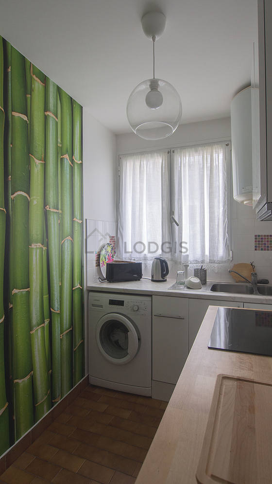 Kitchen where you can have dinner for 2 person(s) equipped with washing machine, refrigerator, freezer, extractor hood