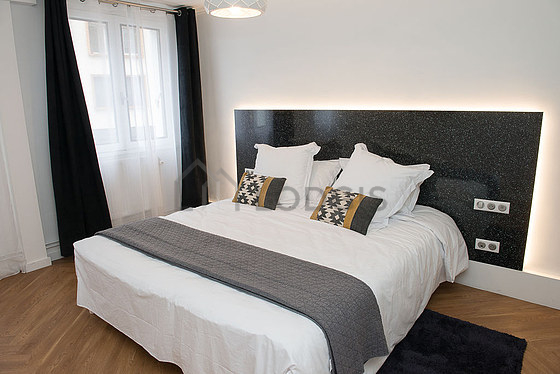 Bedroom with wooden floor