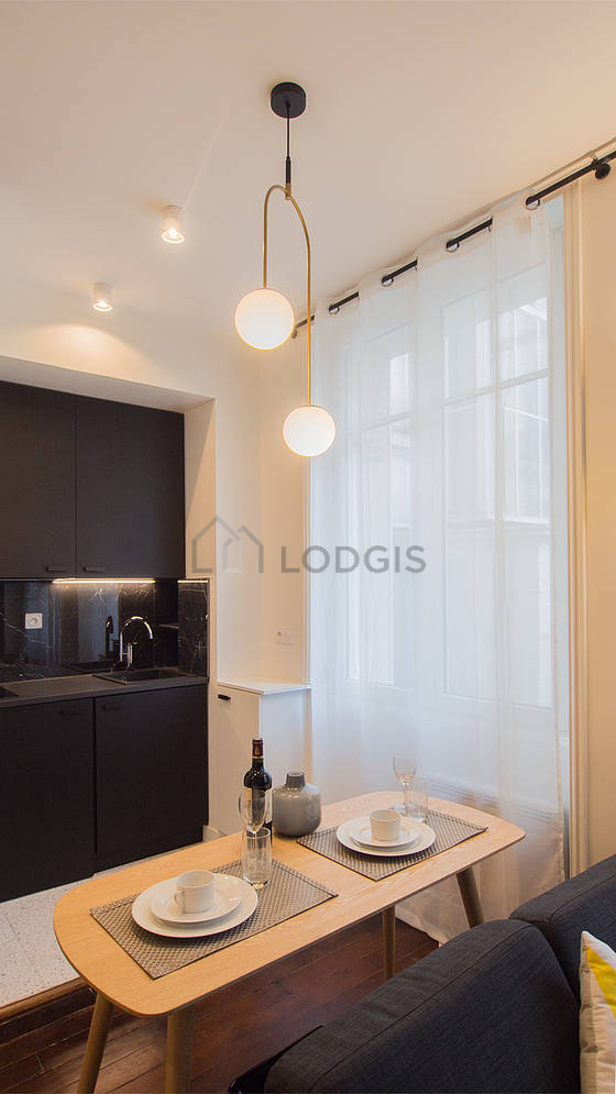 Kitchen equipped with washing machine, refrigerator, extractor hood, crockery