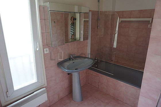 Bathroom equipped with shower in bath tub