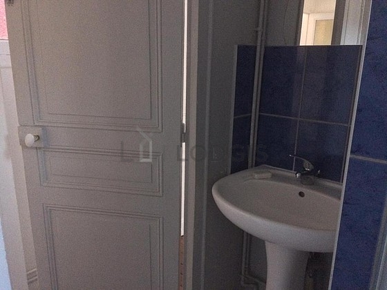 Bathroom equipped with washing machine, separate shower