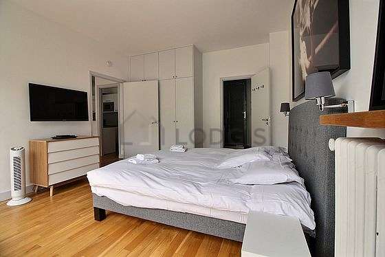 Very bright bedroom equipped with tv, 1 armchair(s)