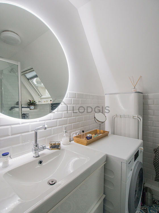 Bathroom equipped with washing machine, shelves