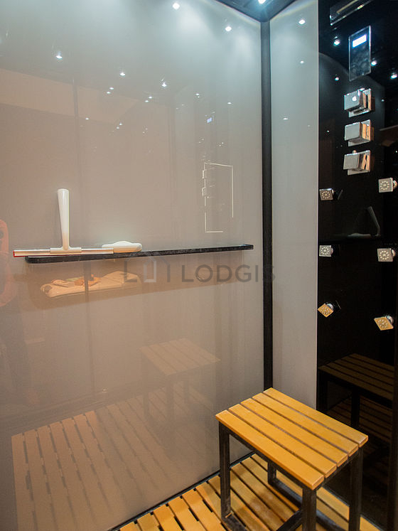 Bathroom equipped with washing machine, hair-dryer