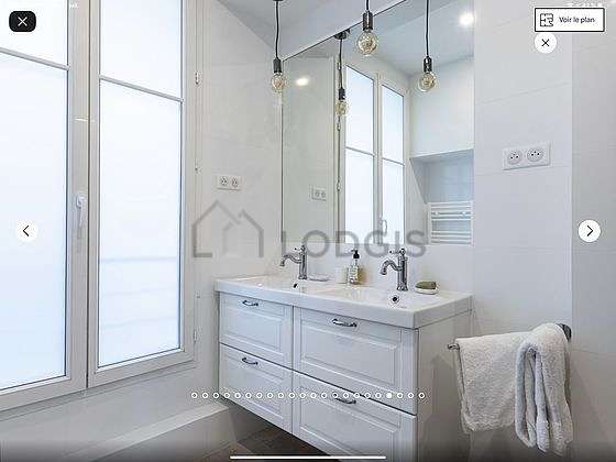 Pleasant and very bright bathroom with windows and with tilefloor