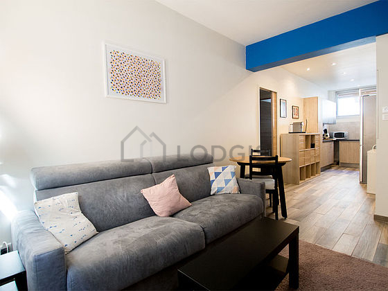 Living room with windows facing the road