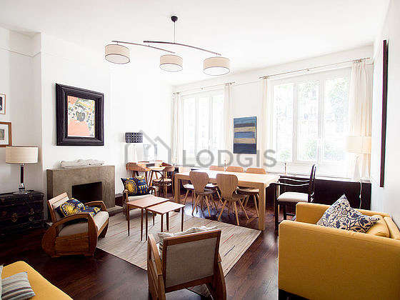 Very quiet living room furnished with tv, fan, 4 armchair(s), 7 chair(s)