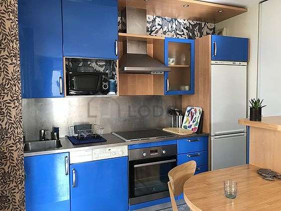 Kitchen where you can have dinner for 2 person(s) equipped with washing machine, refrigerator, extractor hood, crockery