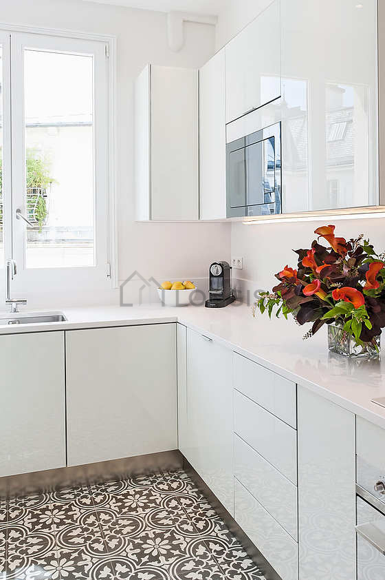 Bright kitchen with windows facing the courtyard