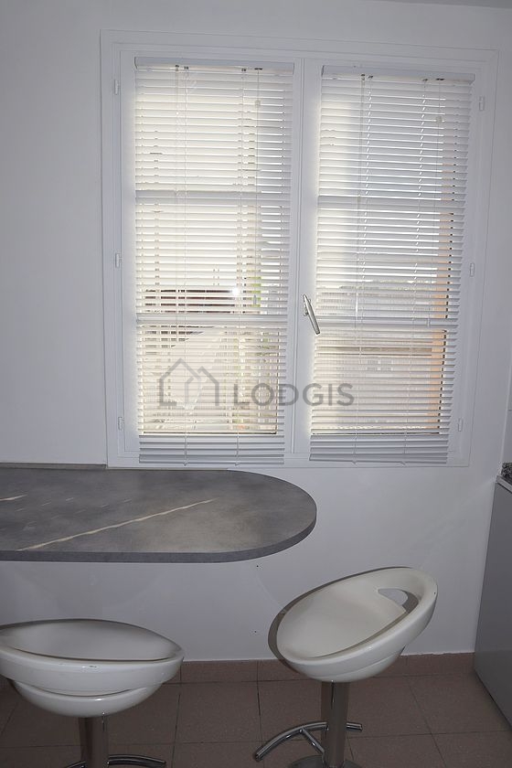 Kitchen equipped with dishwasher, hob, refrigerator, extractor hood