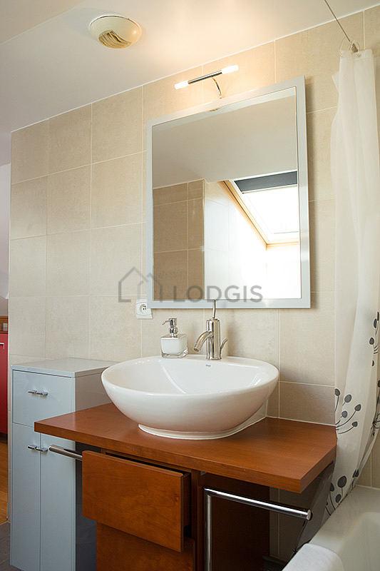 Bathroom equipped with washing machine, bath towels