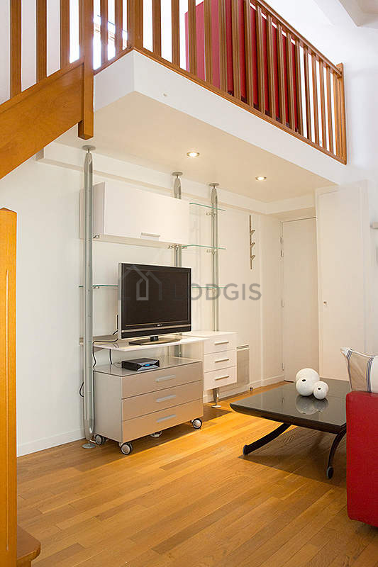 Bright living room furnished with cupboard, 1 chair(s)