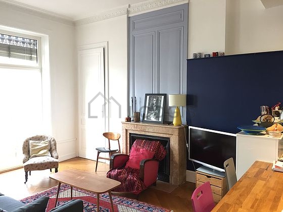 Quiet living room furnished with tv, hi-fi stereo, 1 armchair(s), 1 chair(s)