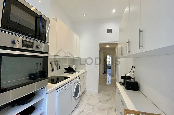 Kitchen equipped with washing machine, dryer, refrigerator, freezer