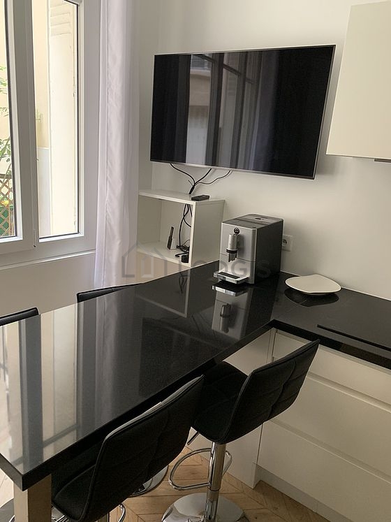 Kitchen equipped with washing machine, dryer, refrigerator, freezer