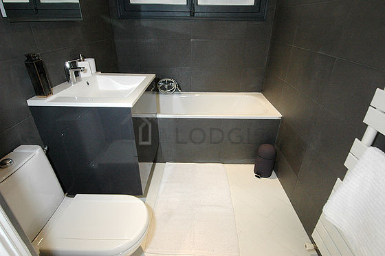 Pleasant and very bright bathroom with tile floor
