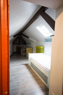 Chambre de 9m² avec du parquetau sol