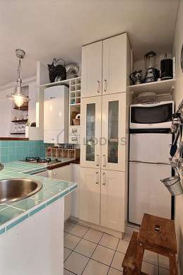 Kitchen equipped with washing machine, refrigerator