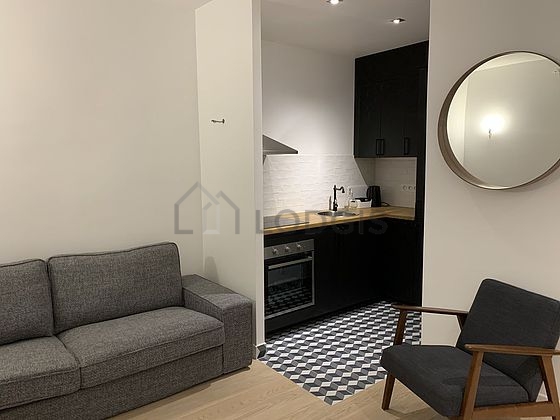 Quiet living room furnished with tv, 1 armchair(s)