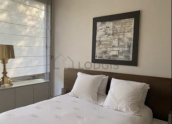 Chambre de 14m² avec du parquet au sol