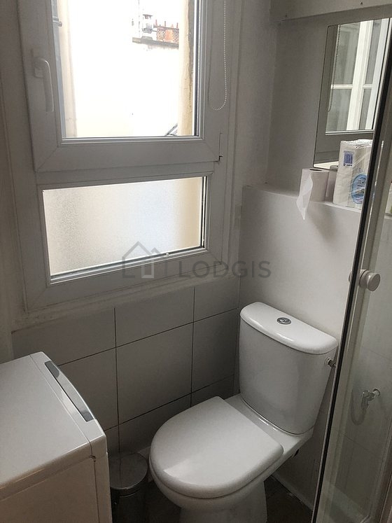Bathroom equipped with washing machine, bath towels