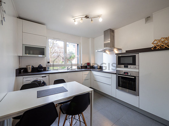 Kitchen where you can have dinner for 4 person(s) equipped with washing machine, refrigerator, extractor hood, crockery