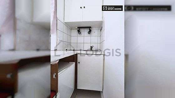 Kitchen equipped with hob, refrigerator, crockery