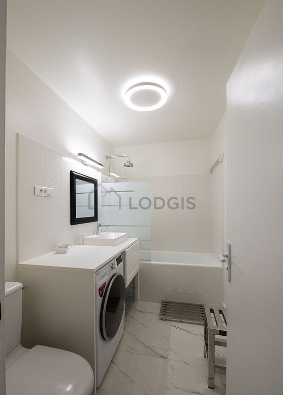 Pleasant and bright bathroom with tile floor