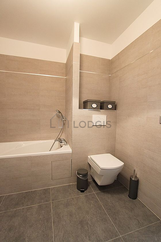 Bathroom equipped with washing machine, bath towels