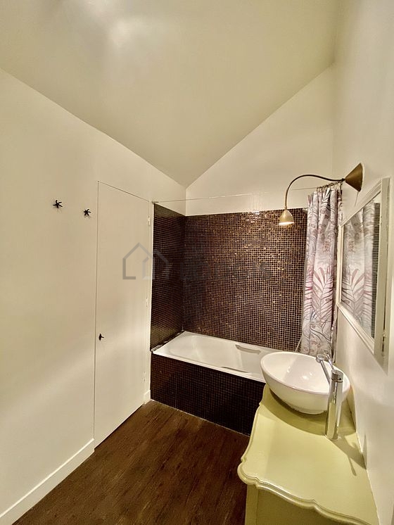 Pleasant and bright bathroom with tile floor