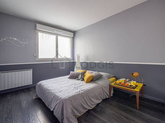 Bedroom with wooden floor
